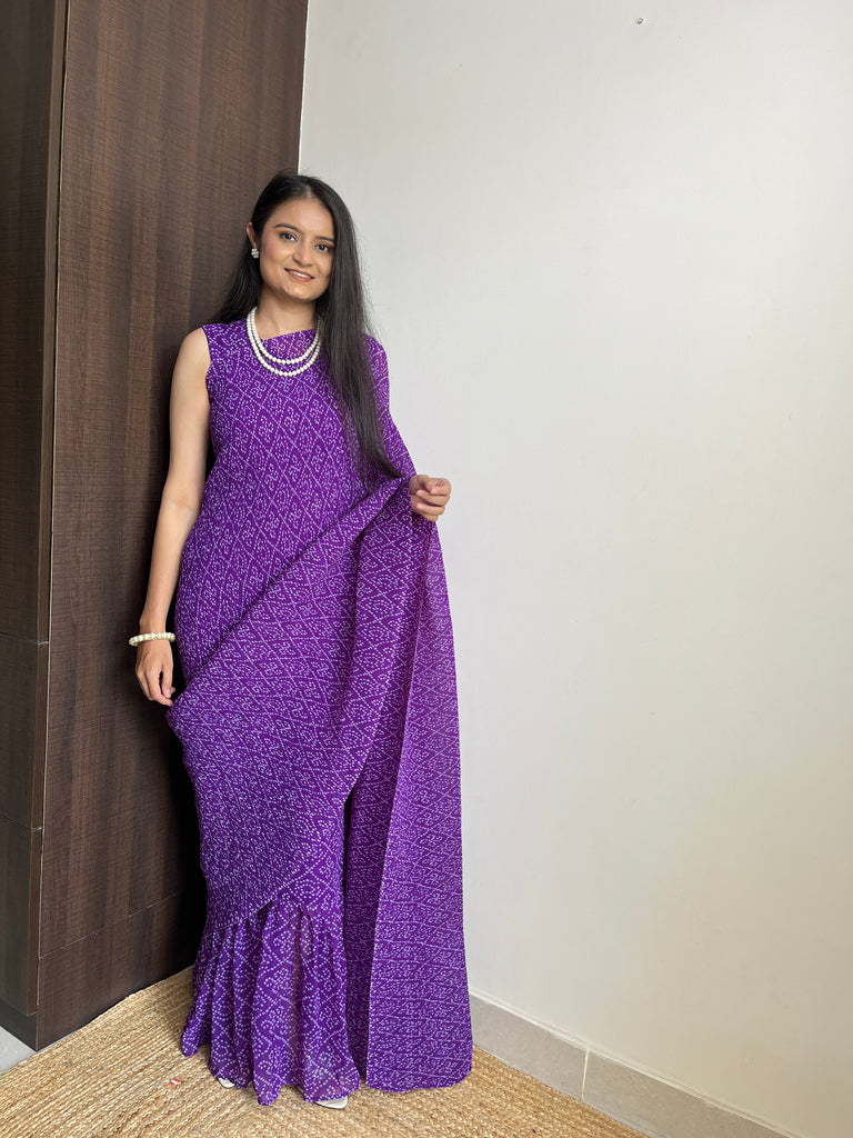 Embrace Effortless Elegance with the Purple Faux Georgette Saree Gown Featuring Bandhani Print
